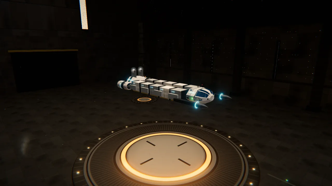 A freighter on the landing pad in a station hangar